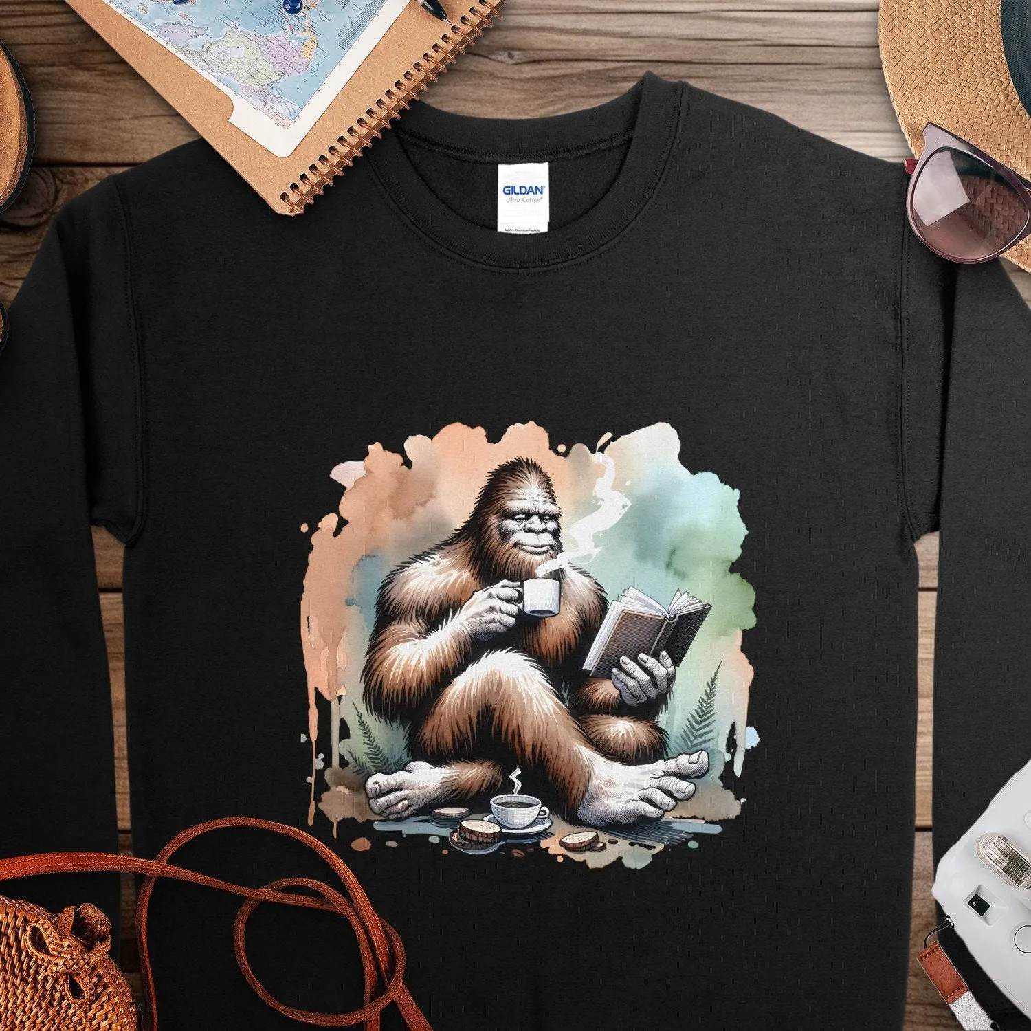 Bigfoot Reading Book Sweatshirt, Cozy Sasquatch Tea Time Tee, Unique Cryptid Lovers Gift, Nature Inspired Graphic Shirt, Coffee Lover Shirt